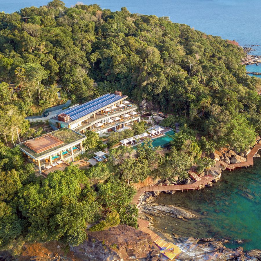 An aerial view of Six Senses Krabey Island shows the resort nestled in the island’s lush forest.