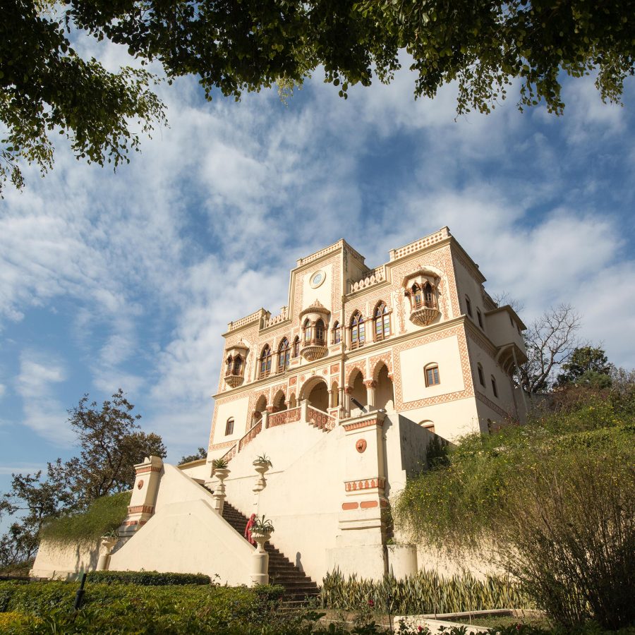 The exterior of Ananda in the Himalayas is a cream white palatial building