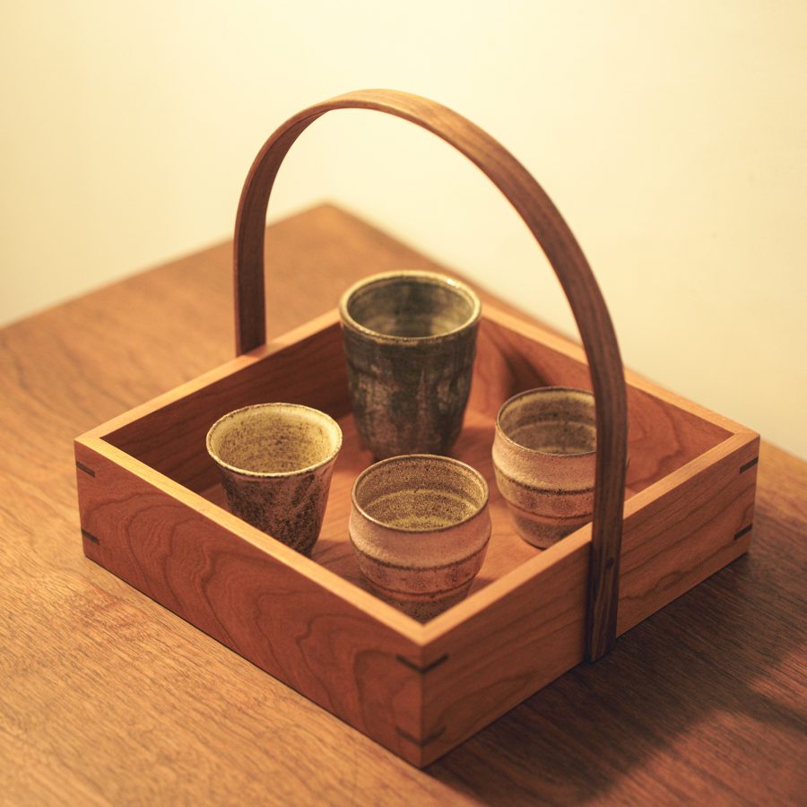Close up on a wooden box and cups available at Zhi Fou in Guangzhou.
