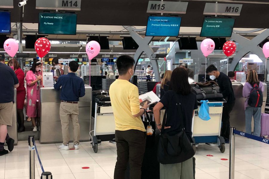 Cathay Pacific check-in counters with passengers and balloons