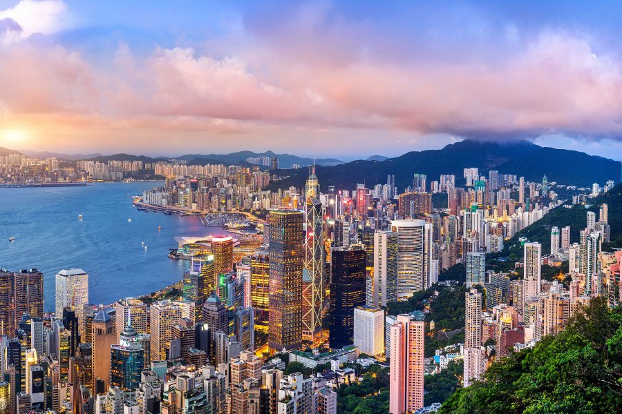 A view of Hong Kong’s skyline and Victoria Harbour at dusk.