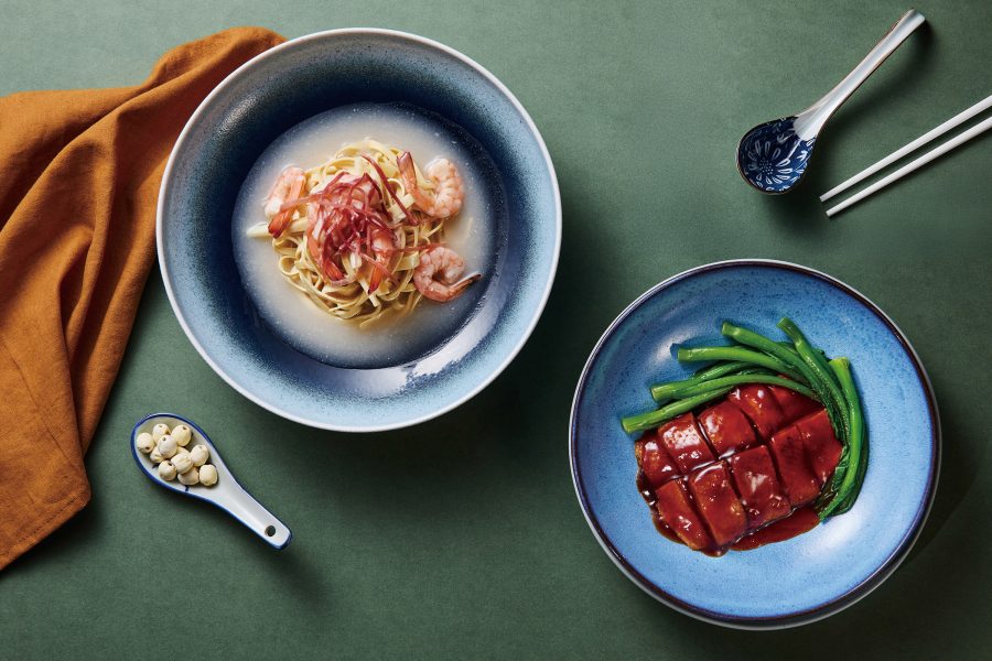 Plates of braised prawns and braised duck from Cathay Pacific’s Chinese Classics menu.