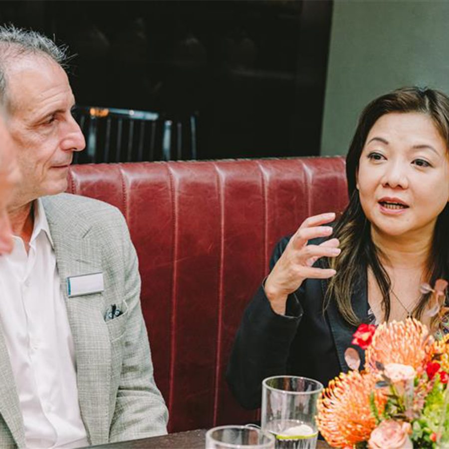 Attendees chatting at the Mott 32 luncheon.