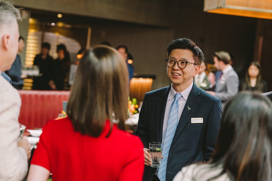 Cathay Group CEO Ronald Lam chatting with attendees at the Mott 32 luncheon.