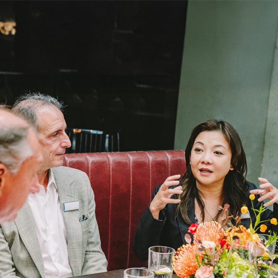 Attendees chatting at the Mott 32 luncheon.
