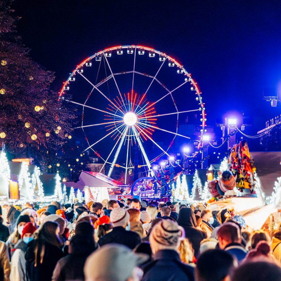 A Ferris wheel shines over crowds at the Winter Wonders celebration in Brussels.