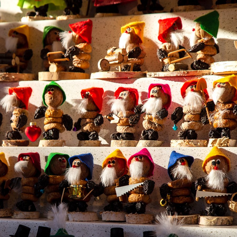 Shelves of wooden sculptures at the Nuremberg Christkindlesmarkt.