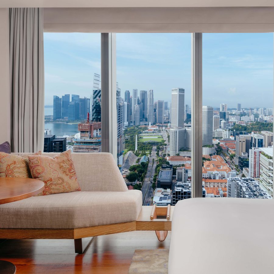 City view of Singapore seen through the windows of a bedroom suite at Andaz Singapore by Hyatt.