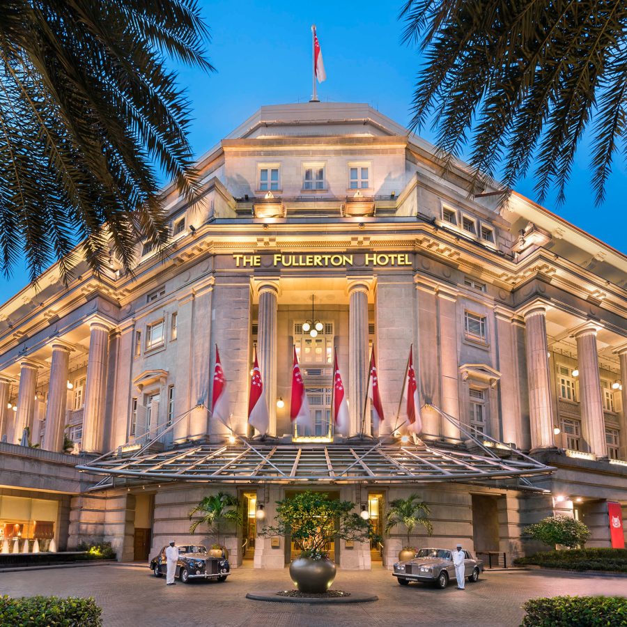 Exterior view of The Fullerton Hotel Singapore at night.