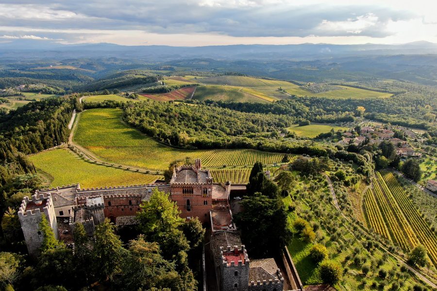 A bird’s eye view of the historic castle Castello di Brolio and Barone Ricasoli winery and vineyards in Chianti, Tuscany, Italy.