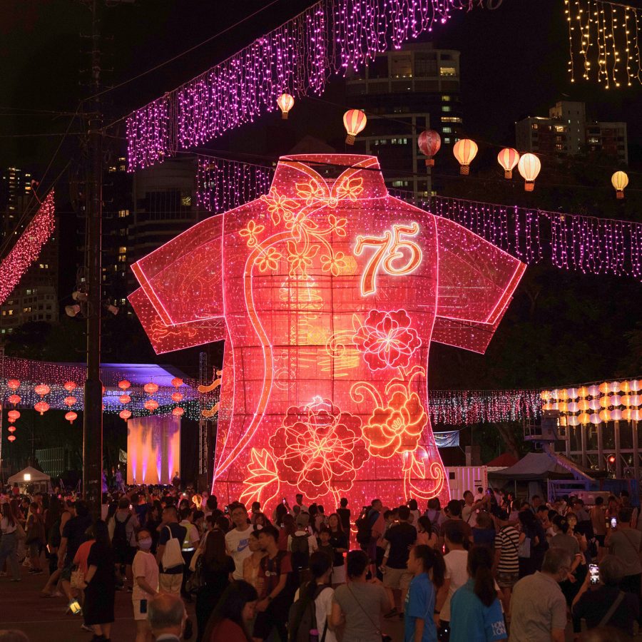 A light-up qipao installation stands on the streets of Hong Kong.  