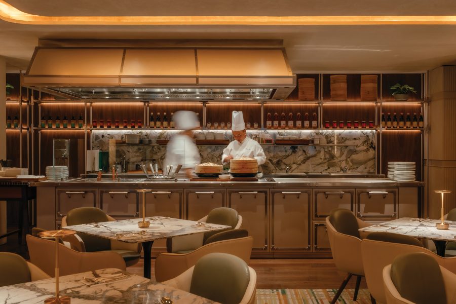 Chefs working in an open kitchen at the Grand Hyatt Singapore.