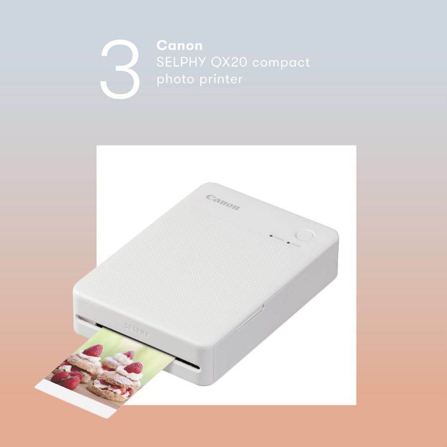 Product shot of the Canon SELPHY QX20 compact photo printer. 
