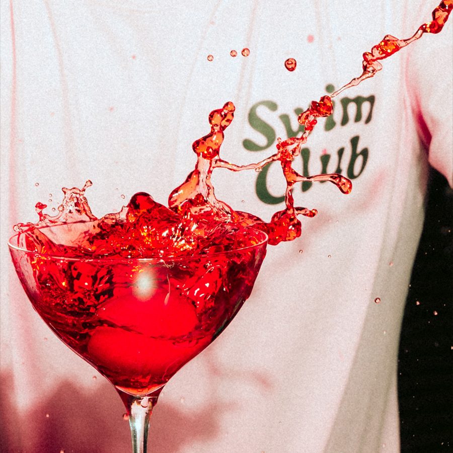 A splashing bright red cocktail.