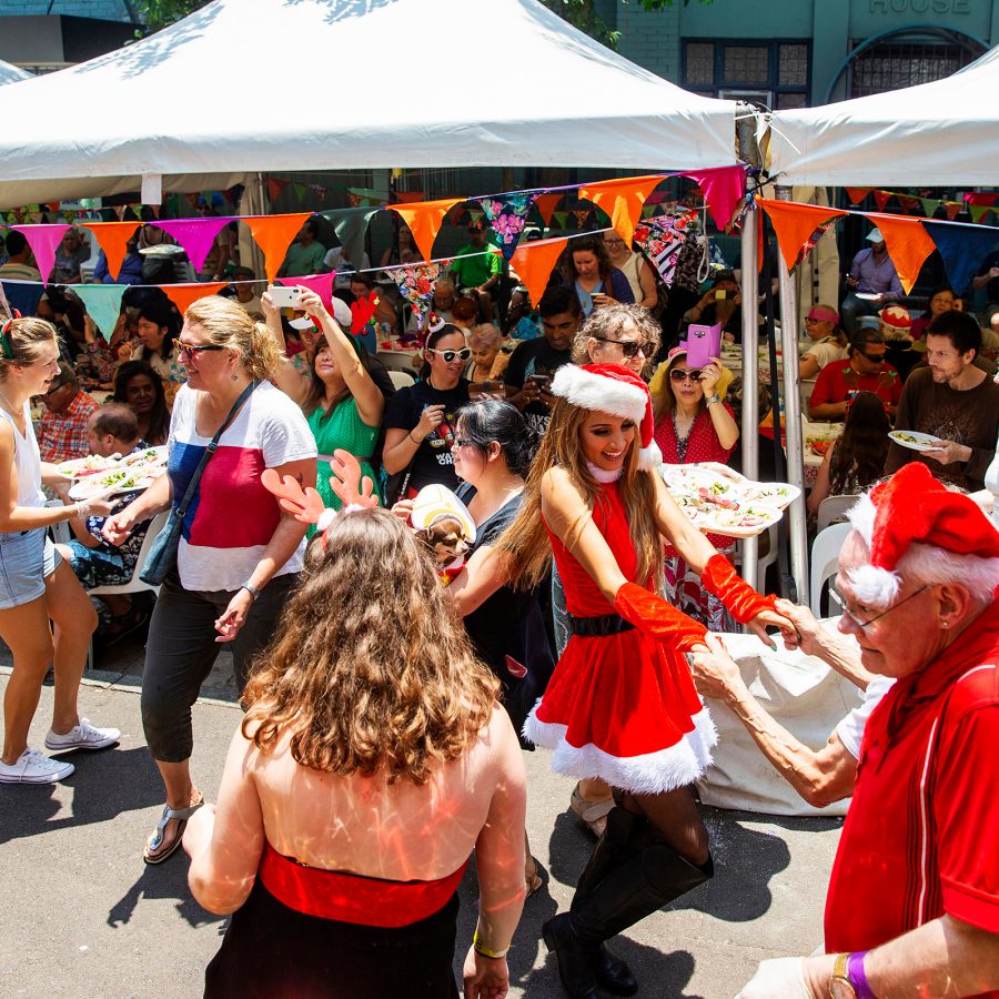 A group of people in festive clothing dancing.