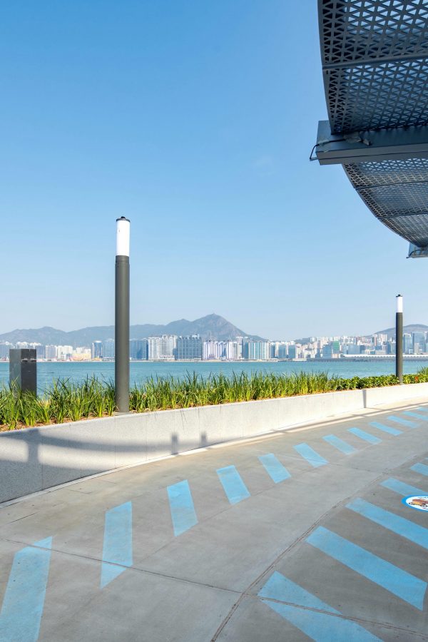 A sheltered area on the East Coast Boardwalk with a view of the ocean.