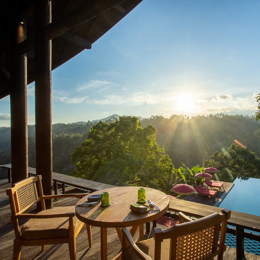 Daytime view of the Balinese jungle and swimming pool at Buahan, A Banyan Tree Escape, Bali. 