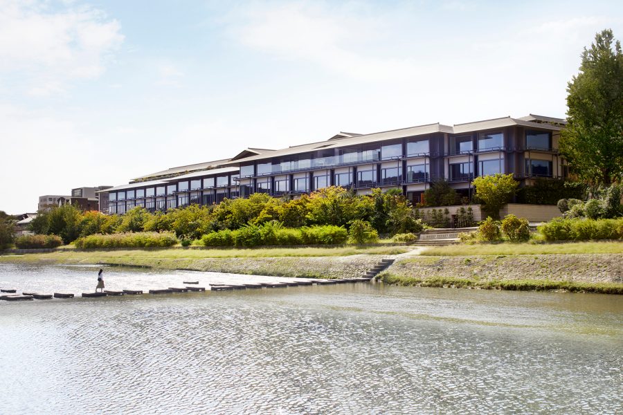 Exterior daytime view of The Ritz-Carlton, Kyoto from the banks of the Kamo River. 
