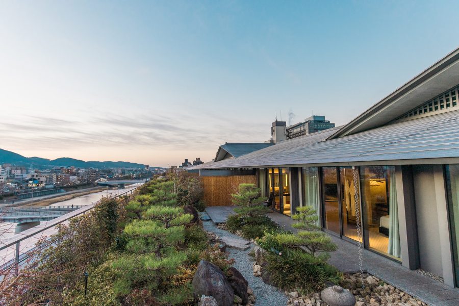 Exterior daytime view of The Ritz-Carlton, Kyoto overlooking the Kamo River.