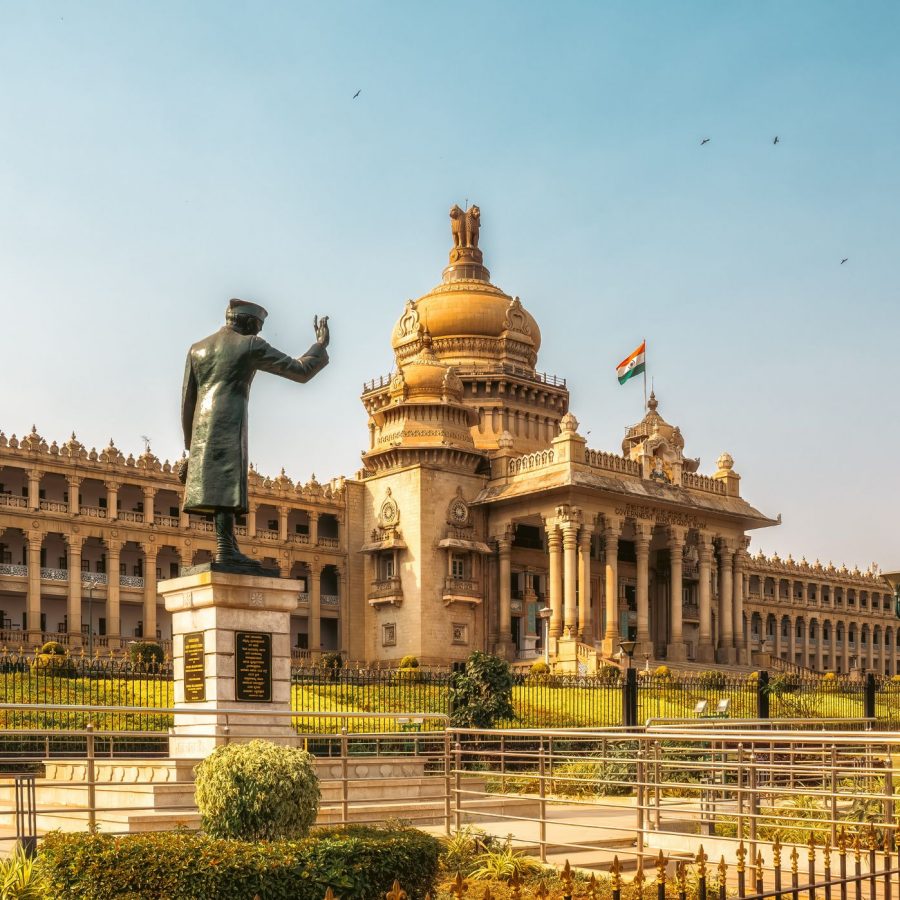 Tudor-style façade of Bangalore Palace with turrets and landscaped grounds
