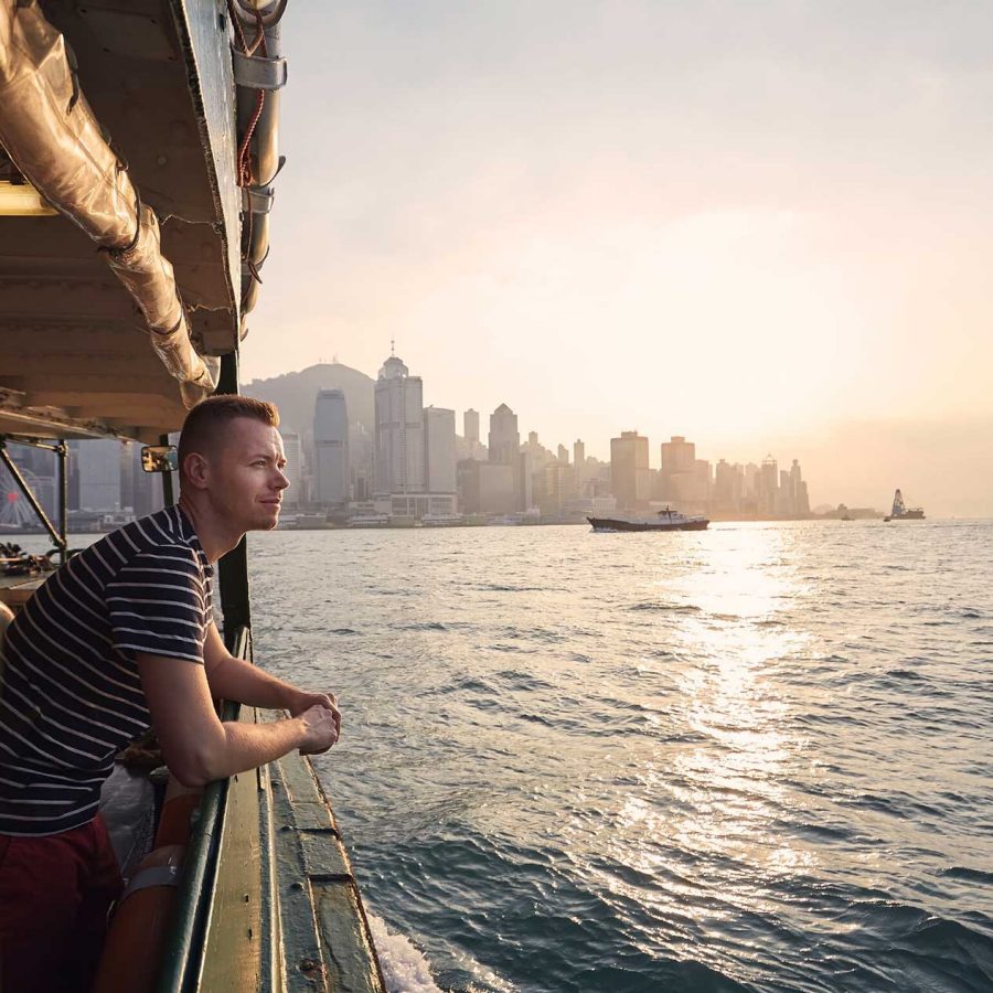Man on star ferry looking over water. Credit: 123RF