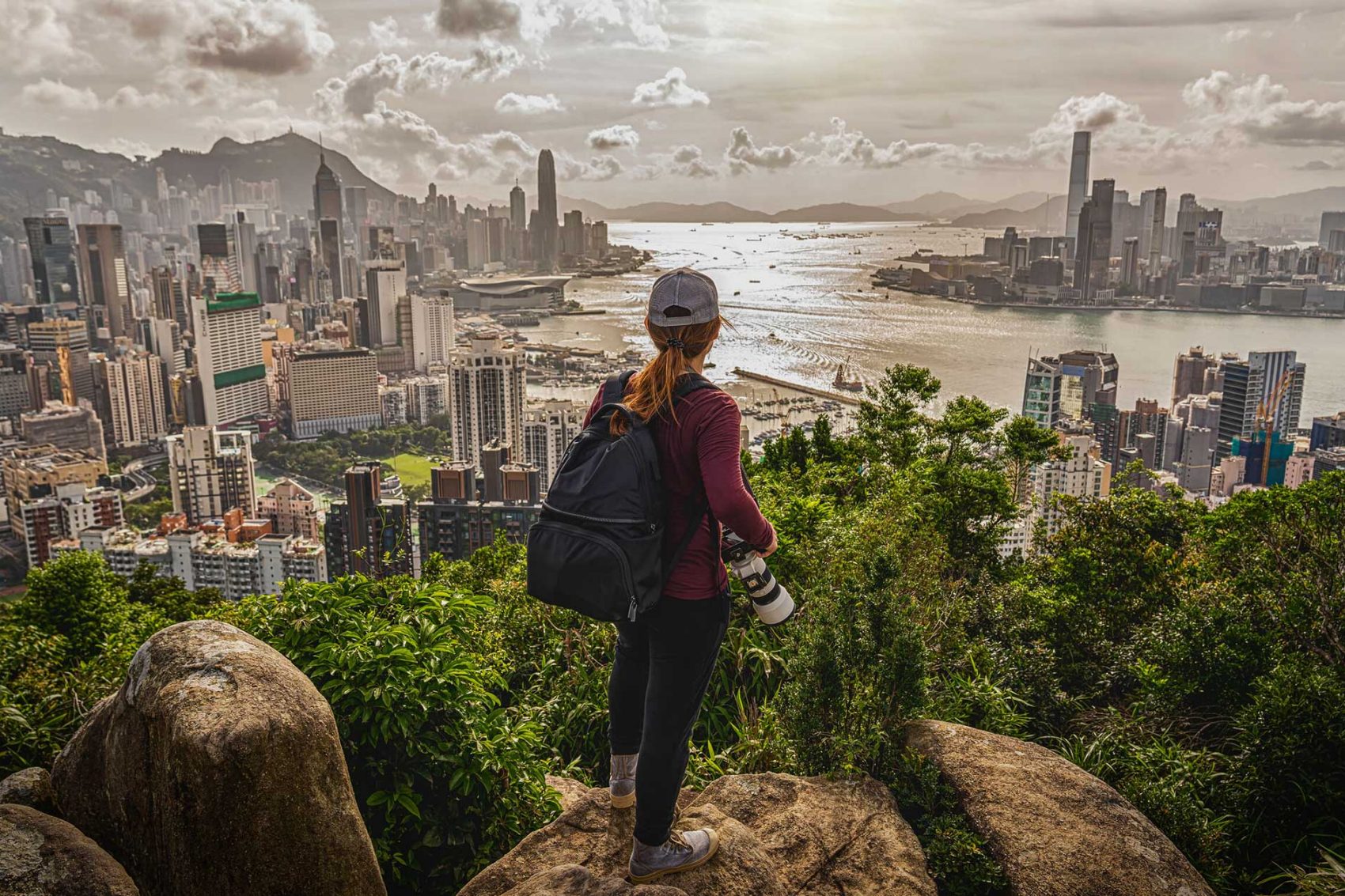 Hiker looking over Victoria Harbour. Credit: 123F