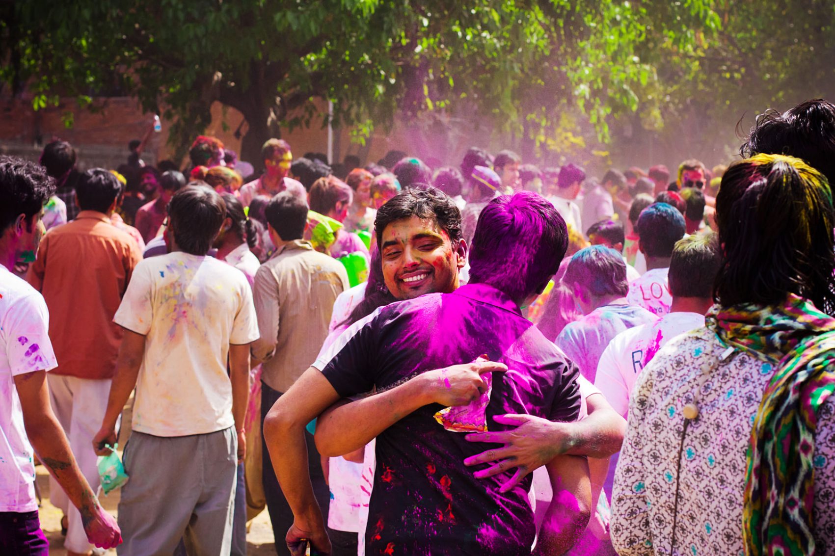 Two people hugging during Holi in India. Credit: Shutterstock