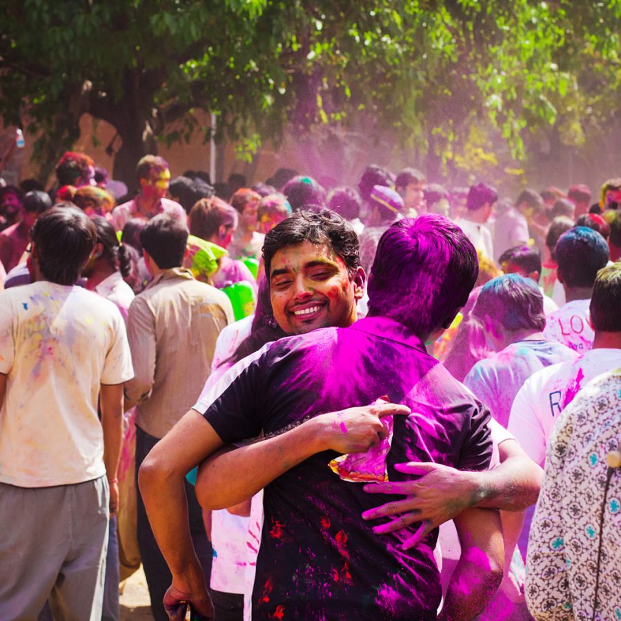 Two people hugging during Holi in India. Credit: Shutterstock