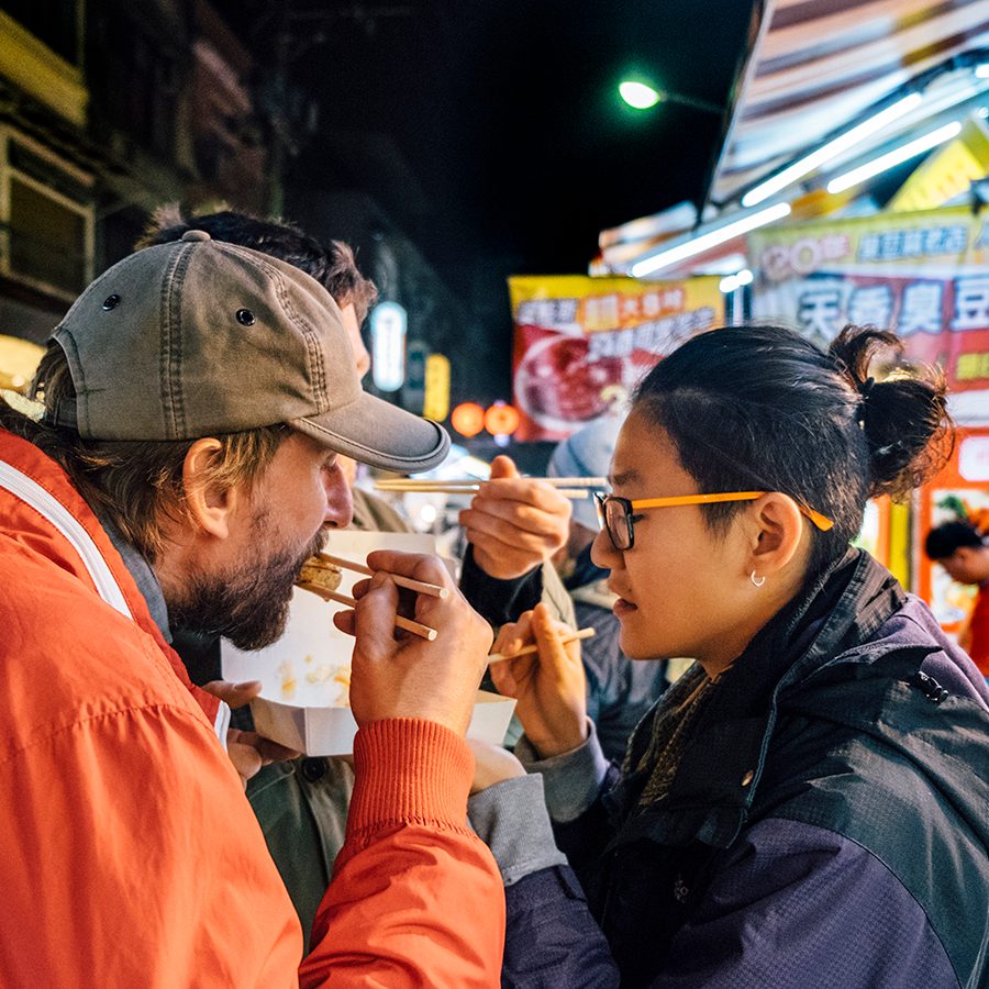 2 people trying Taipei street food