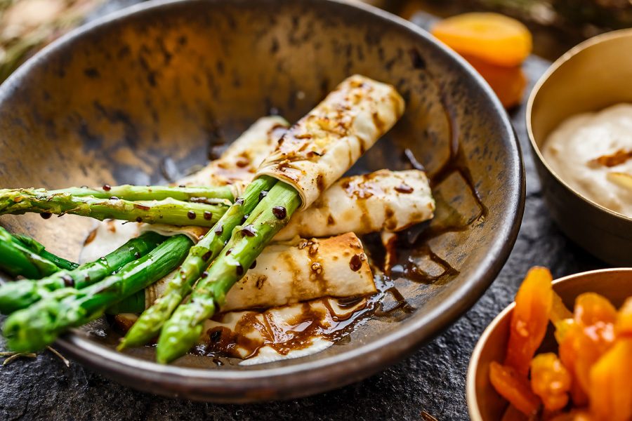 A dish of baked asparagus salad wrapped in phillo pastry, served with a side of almond puree, apricots and rosemary relish at Ananda in the Himalayas in Rishikesh, India