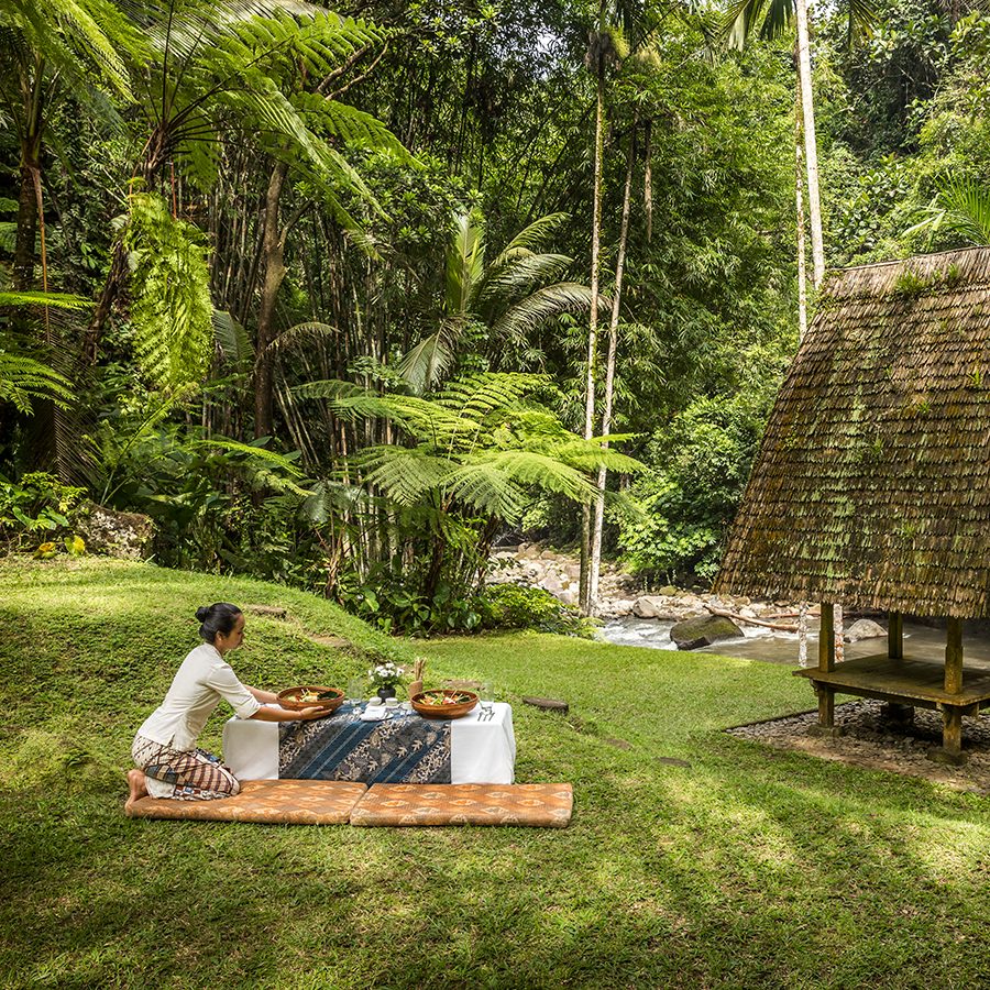 A woman sitting st Como Shambhala Estate