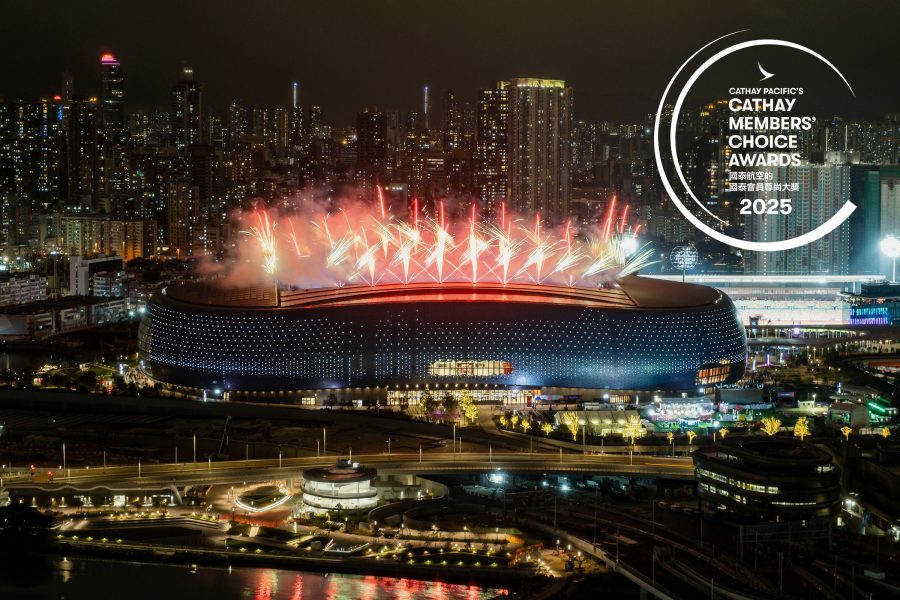 Hong Kong’s Kai Tak Stadium shoots fireworks into the sky from its roof at night.