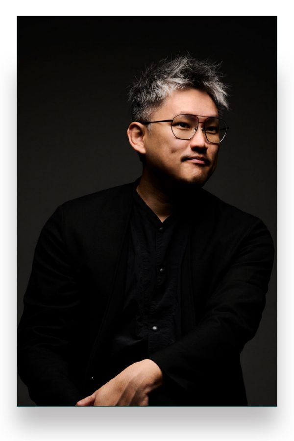  Moody dark portrait of Andy Cheng, Regional Head of Dining at Tatler Asia Group.