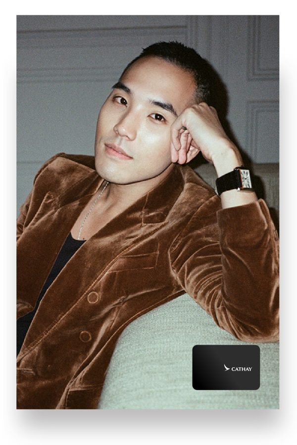 Pen Mané co-founder Calvin Wang smiles for the camera in a brown velvet suit.