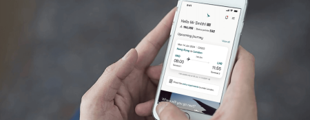 A person holding a mobile and displaying the app screen