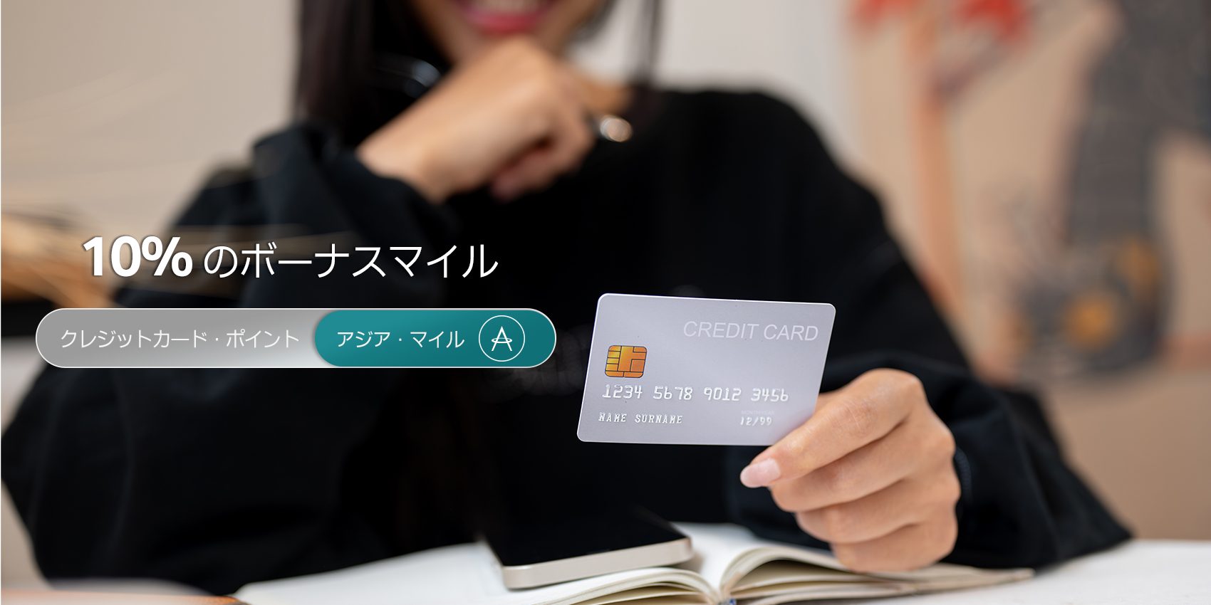 Female holding credit card
