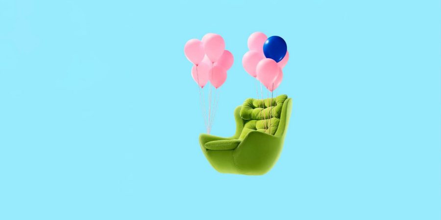 A floating green chair with pink balloons