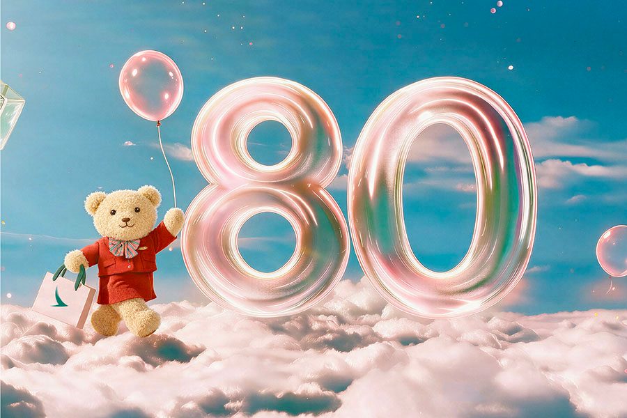 Cathay Bear standing on a sea of cloud holding a balloon and shopping bag, standing next to a big 80.