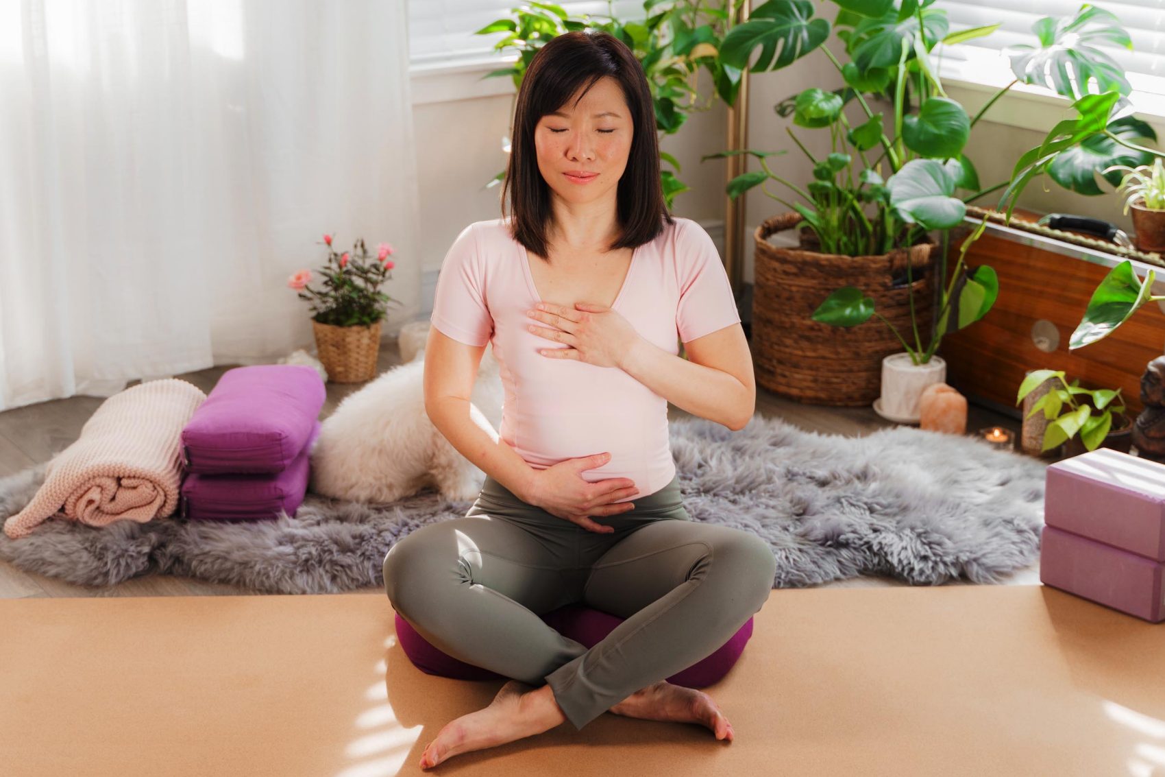 Yoga instructor Zoe Ho practising deep belly breathing