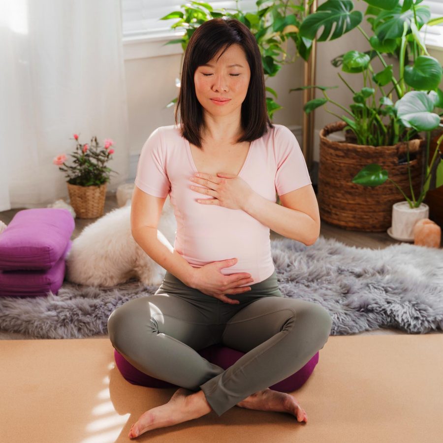Yoga instructor Zoe Ho practising deep belly breathing