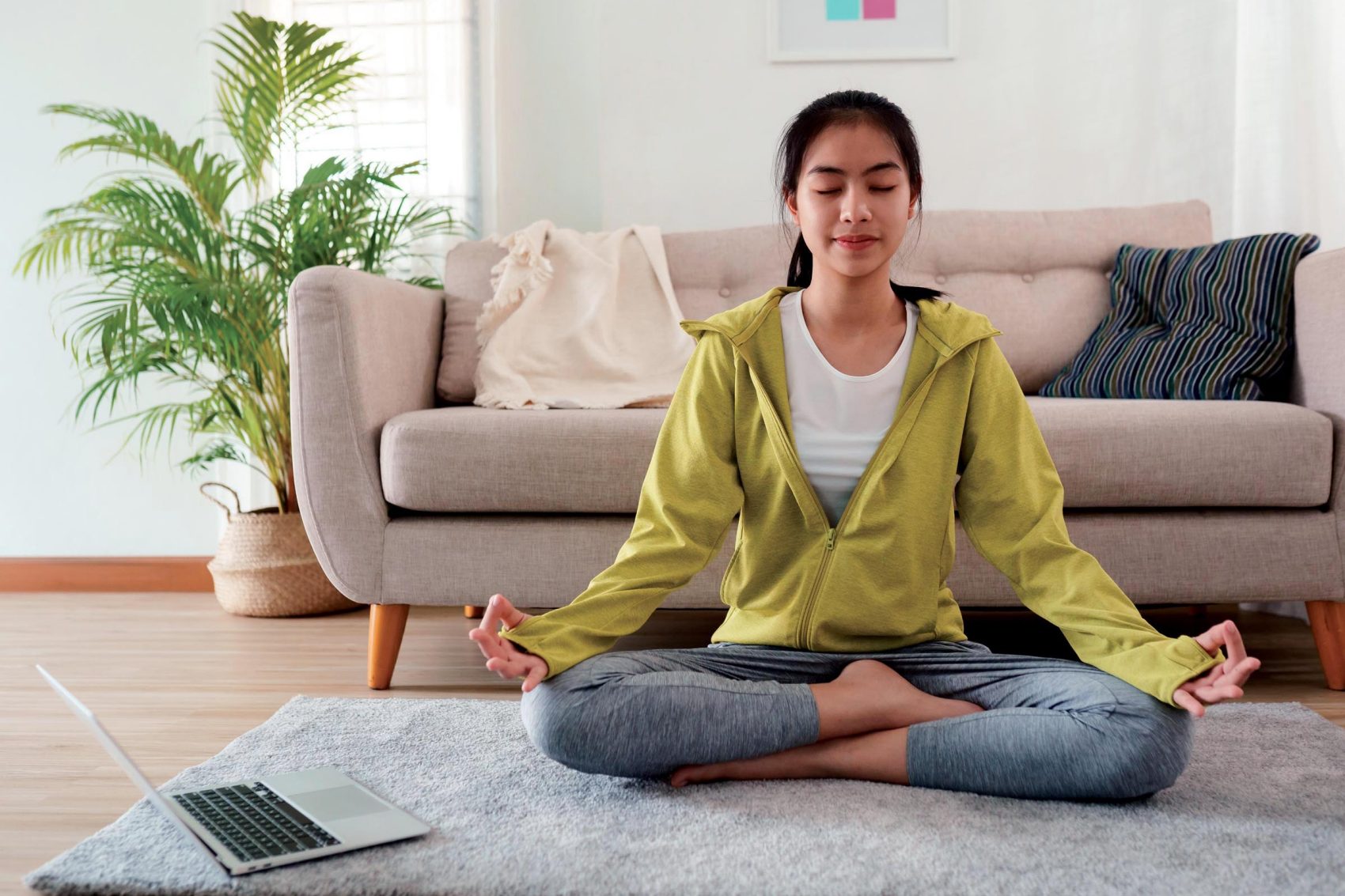 Teenage girl in lotus position