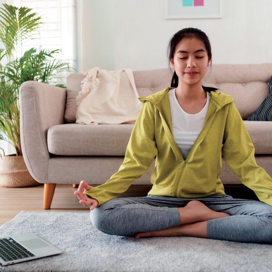 Teenage girl in lotus position