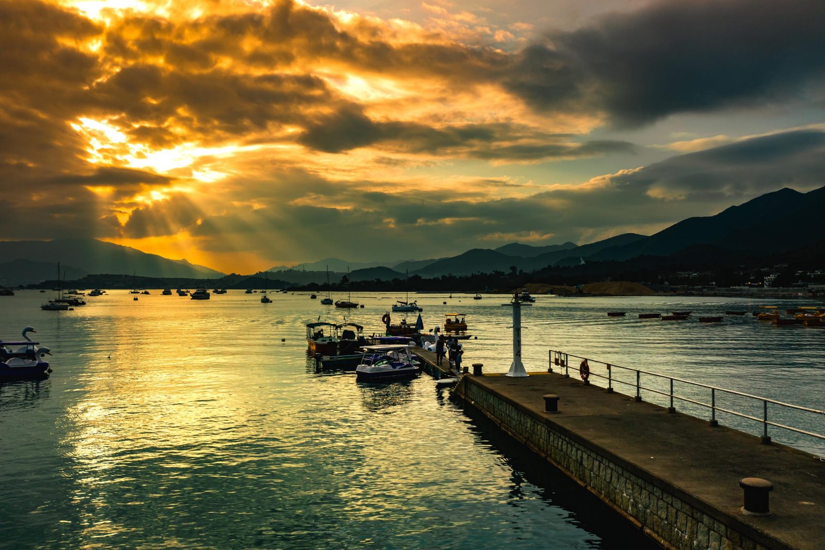 Beautiful golden sunset over a pier in Tai Po