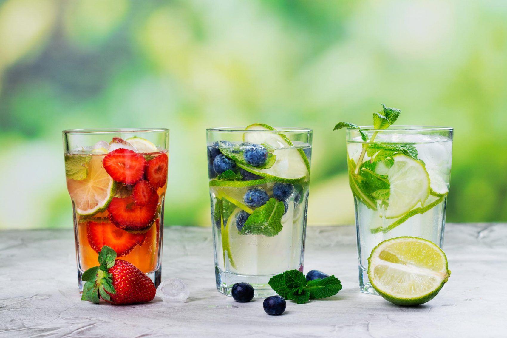 Three glasses of fruit infused water