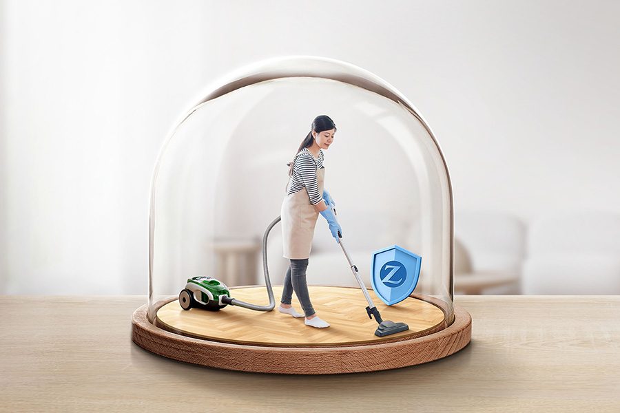 A helper vacuumming at home inside a globe.