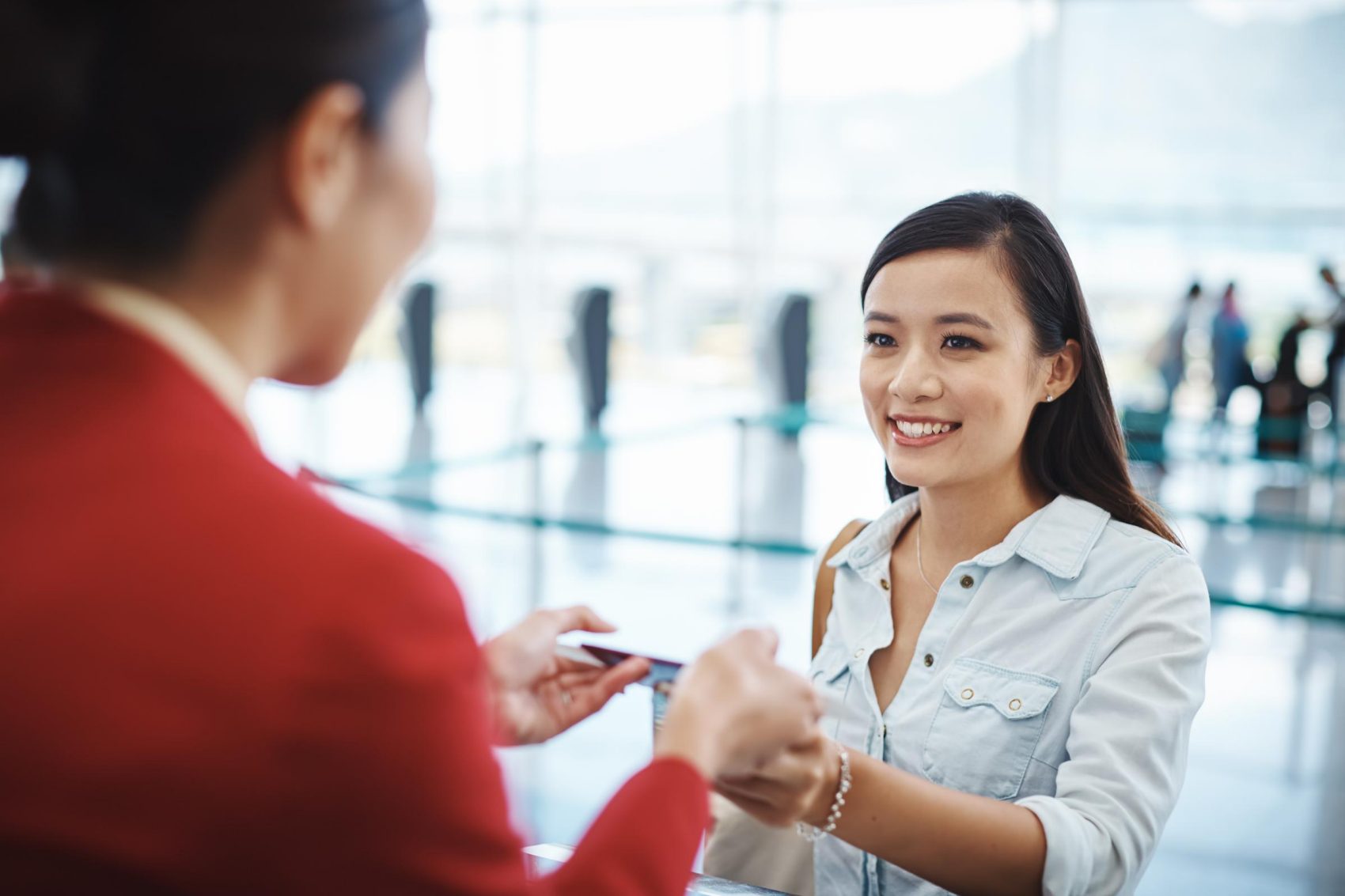 Woman checking in at Premium Economy
