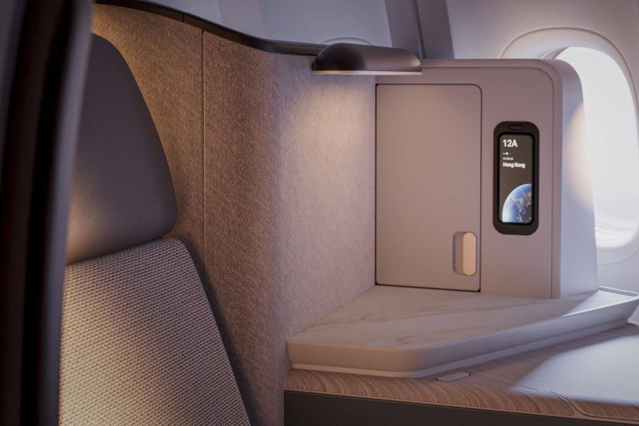  A pair of slippers and items from Cathay Pacific's amentiy kit sitting on the ledge of a flatbed in an aircraft.