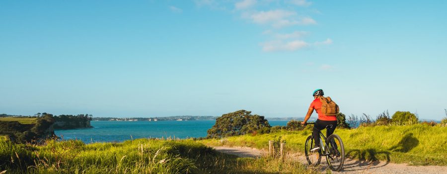 Generic man on bike cycling on mountain