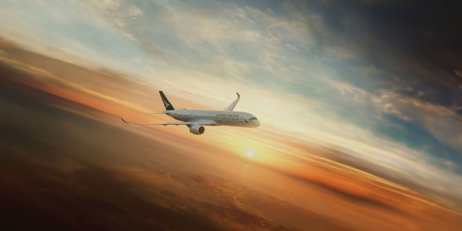 Cathay Pacific plane flying at sunset